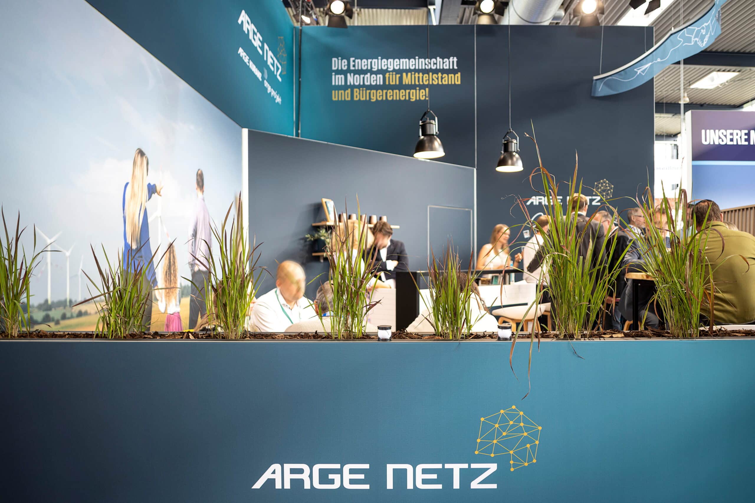 Grüne Pflanzen am Arge Netz Messestand